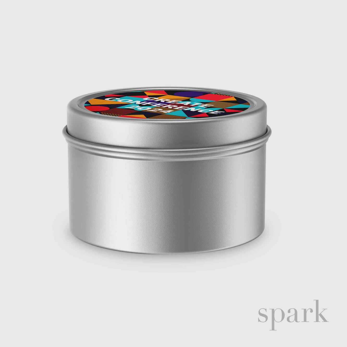 4oz silver tin candle featuring a custom lid label with branded artwork.