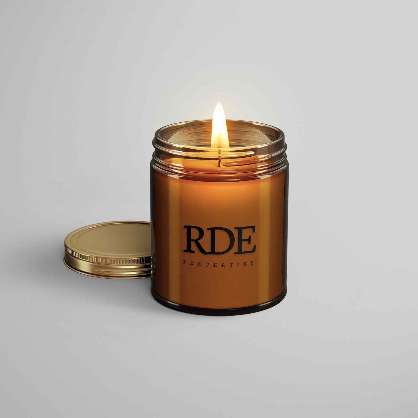4oz amber glass candle with custom branding.