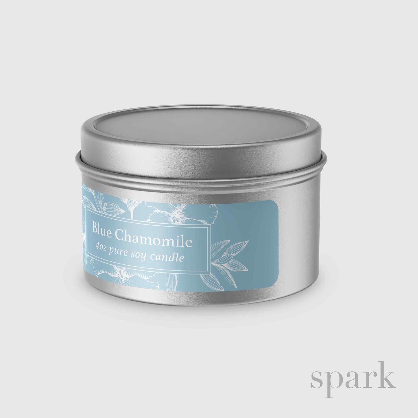 Custom branded silver tin candle produced by a candle manufacturer for corporate gifts and swag.