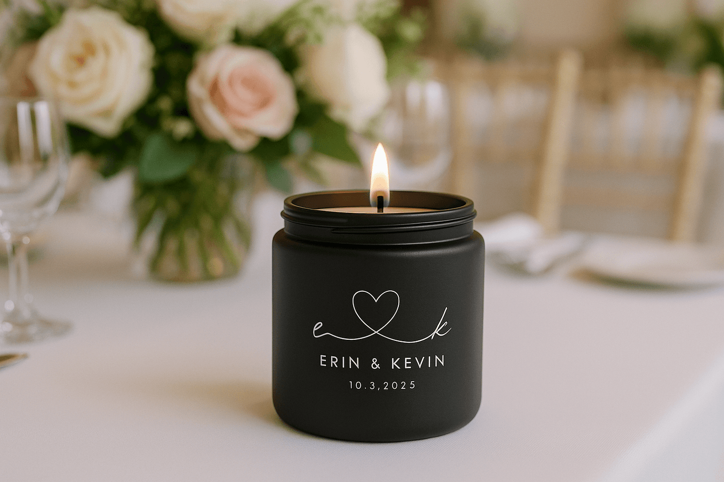 4oz black glass candle with personalized text on a wedding table setting with flowers and glasses in the background