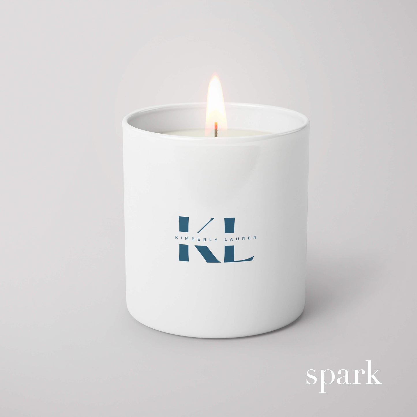 Close-up of single-color logo imprint on a 6oz matte white glass candle.